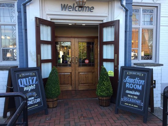 Welcoming entrance to The Court Oak Harborne function area with double doors and event signage.