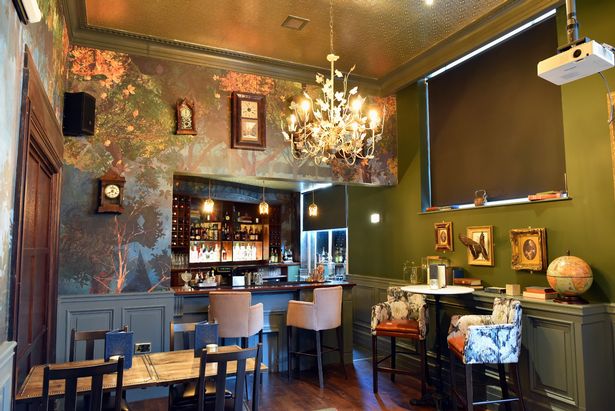 Intimate Secret Bar in Birmingham with elegant chandelier, ideal for private events.