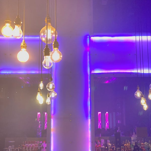 Vibrant Pryzm event space with purple lighting, perfect for networking and celebrations.