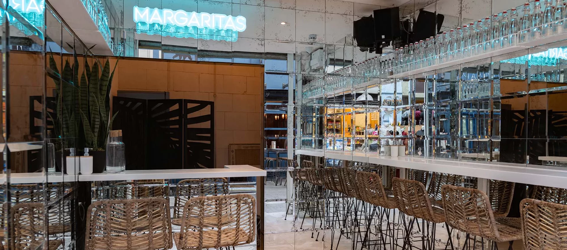 Vibrant Hacha Brixton bar with neon sign, ideal for networking events and social gatherings.