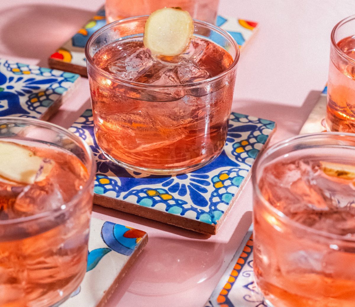 Vibrant cocktails on coasters at Hacha Brixton, perfect for social events and gatherings.