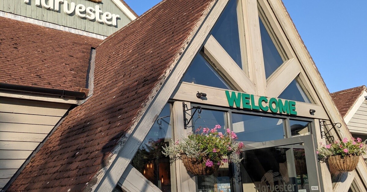 Welcoming pub entrance with charming architecture, ideal for casual meetings and events.