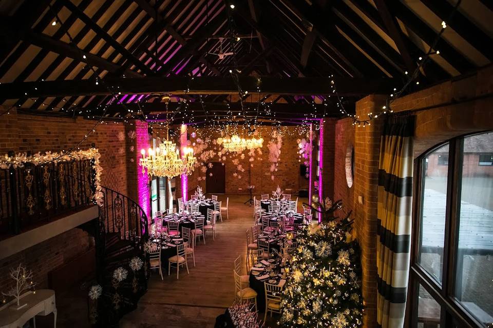 Elegant event space at The Barn, featuring rustic decor for weddings and corporate events.