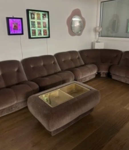 Cozy lounge with plush curved sofa for networking at The Gallery, Missy Decor.