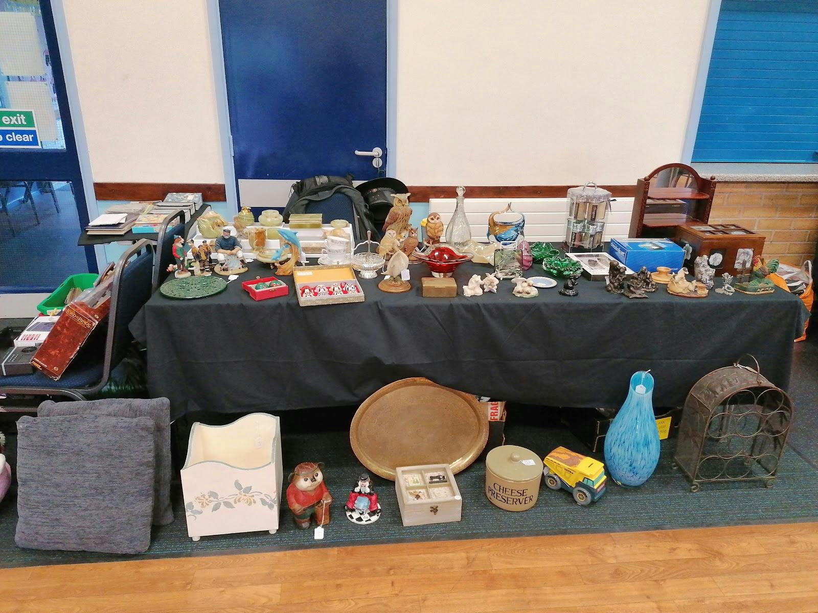 Vintage collectibles display at Layca Community Centre for themed market event.