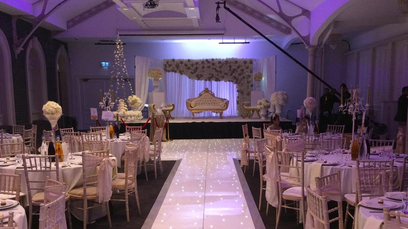 Elegant banquet hall with round tables, perfect for upscale events and celebrations.