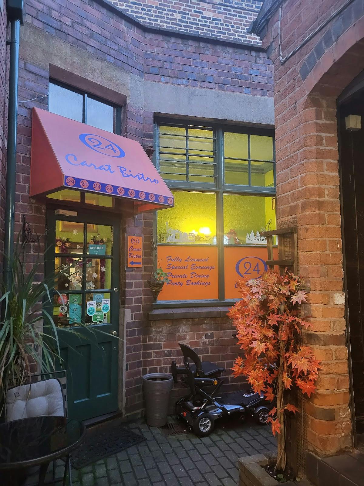 Charming 24K Bistro entrance with vibrant signage, perfect for intimate gatherings and events.