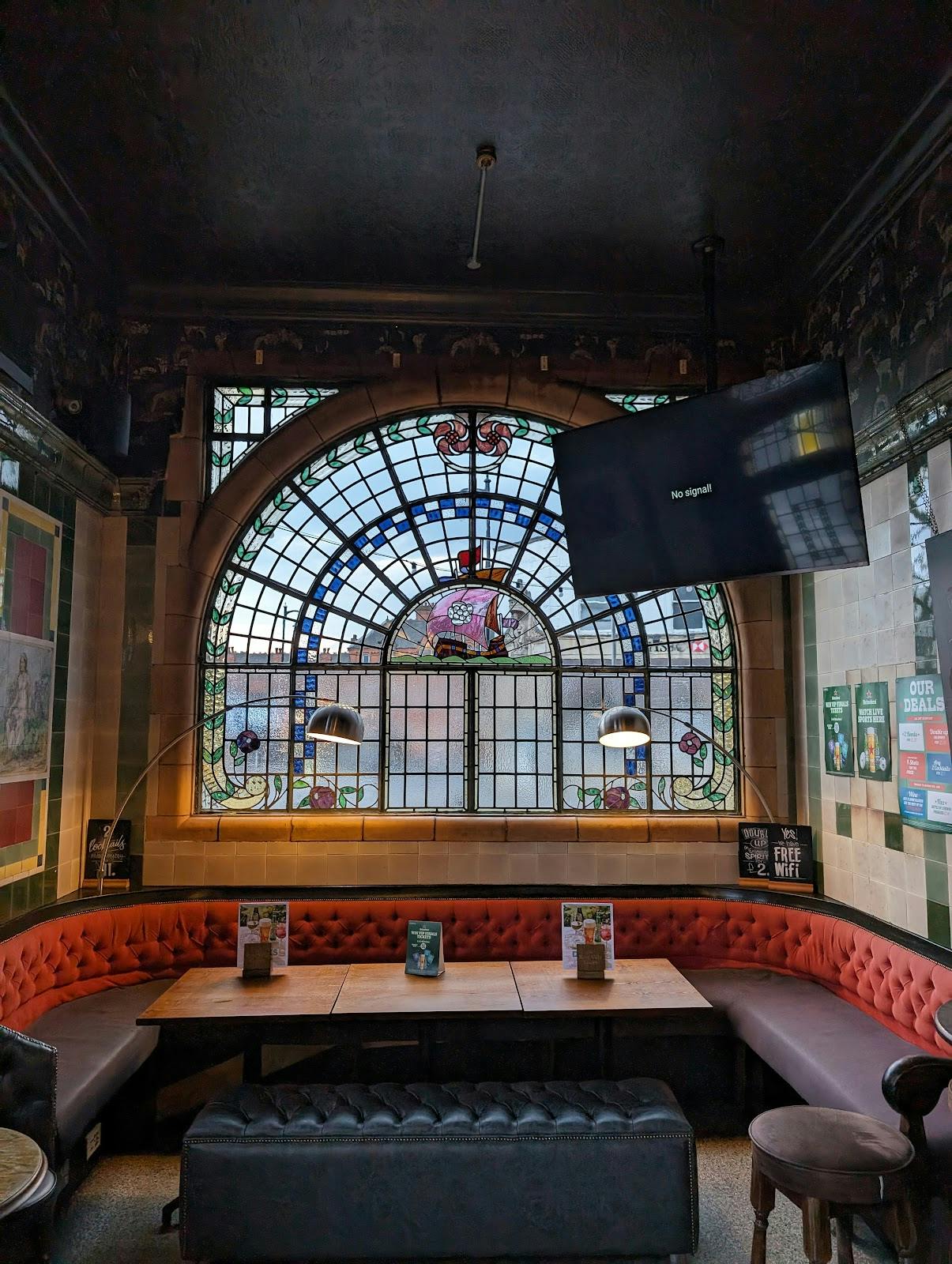 Garden Area at Rose Villa Tavern with stained glass, perfect for events and meetings.