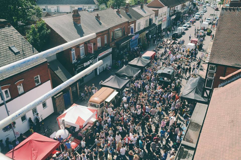"Vibrant street festival at Digbeth Dining Club with diverse food vendors and lively crowd."