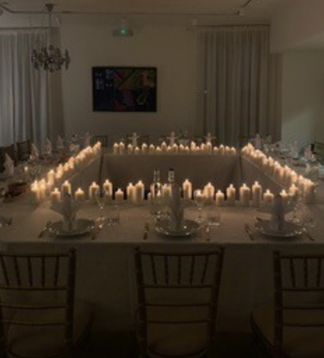 Elegant dinner setting with candles at The Gallery, perfect for networking events.