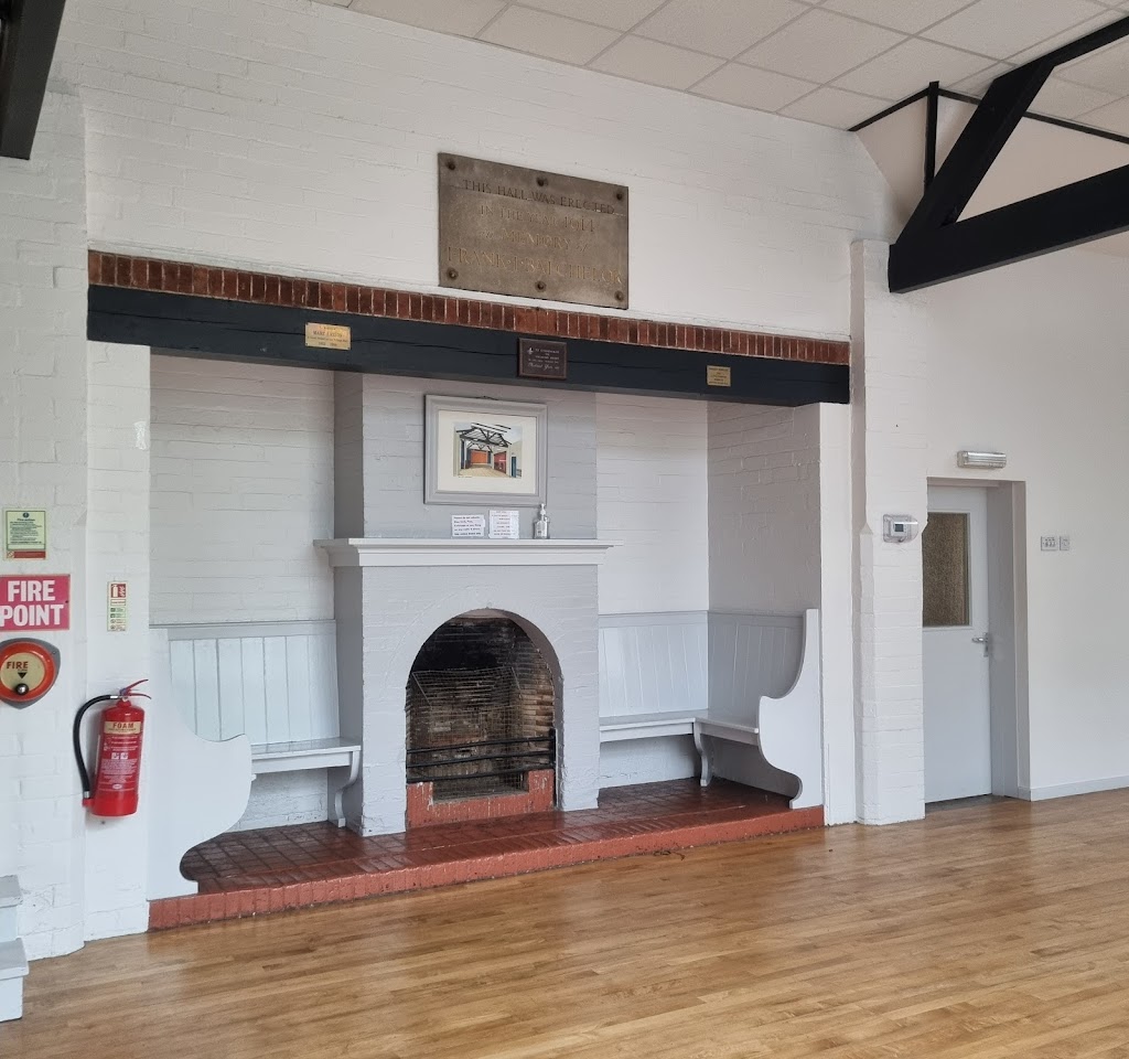 Small Meeting Room in Alvechurch Village Hall with fireplace, ideal for events and gatherings.