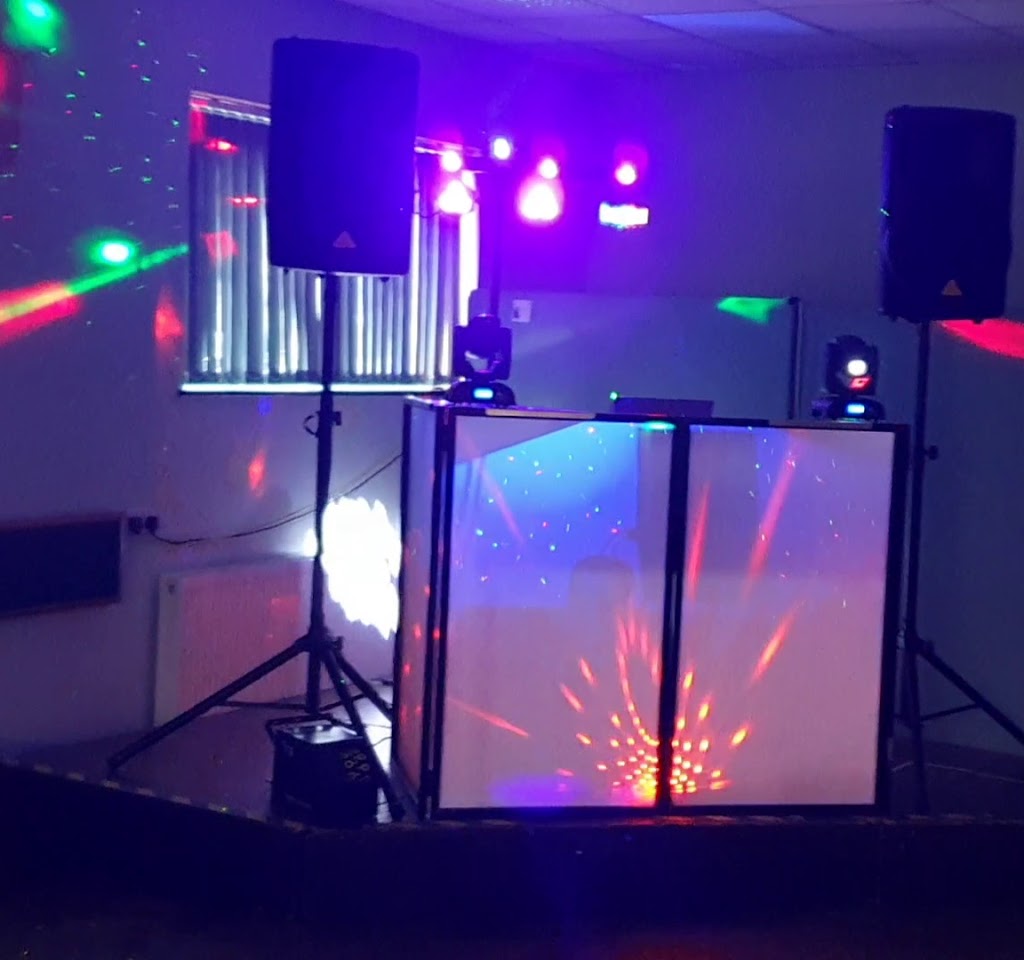 Cheswick Green Village Hall with DJ booth and colorful lighting for vibrant parties.