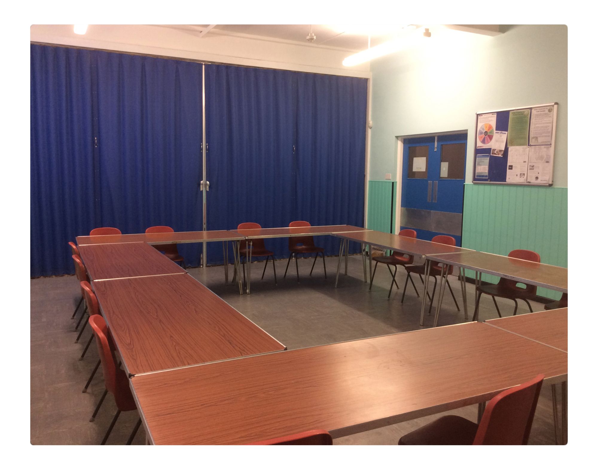 U-shaped meeting room in Quinborne Community Centre, ideal for workshops and discussions.