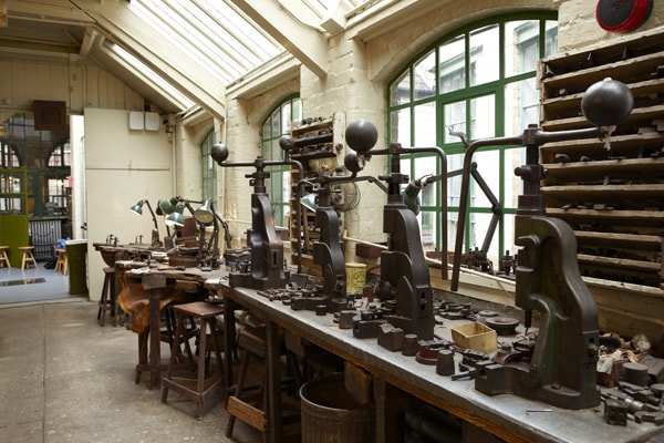 Museum of the Jewellery Quarter workshop with vintage tools for creative events in Birmingham.