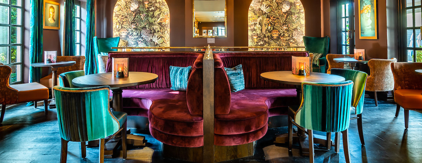 Stylish bar seating area at The Lyttelton Arms for networking events and meetings.