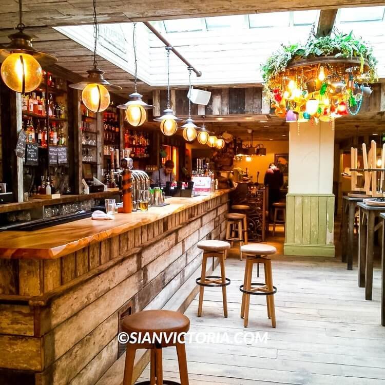 Rustic bar in The Botanist Birmingham, ideal for networking events and gatherings.
