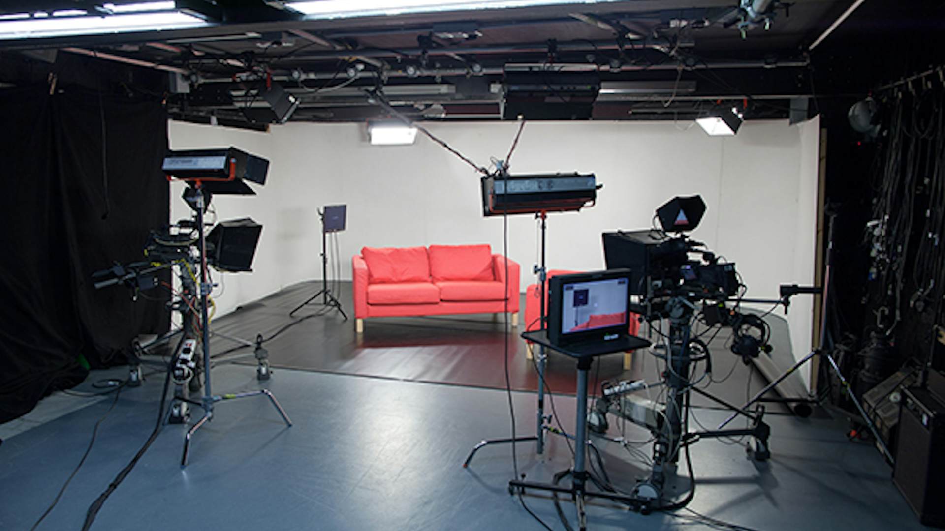 Film and TV studio with bright lighting, ideal for virtual events and live streaming.