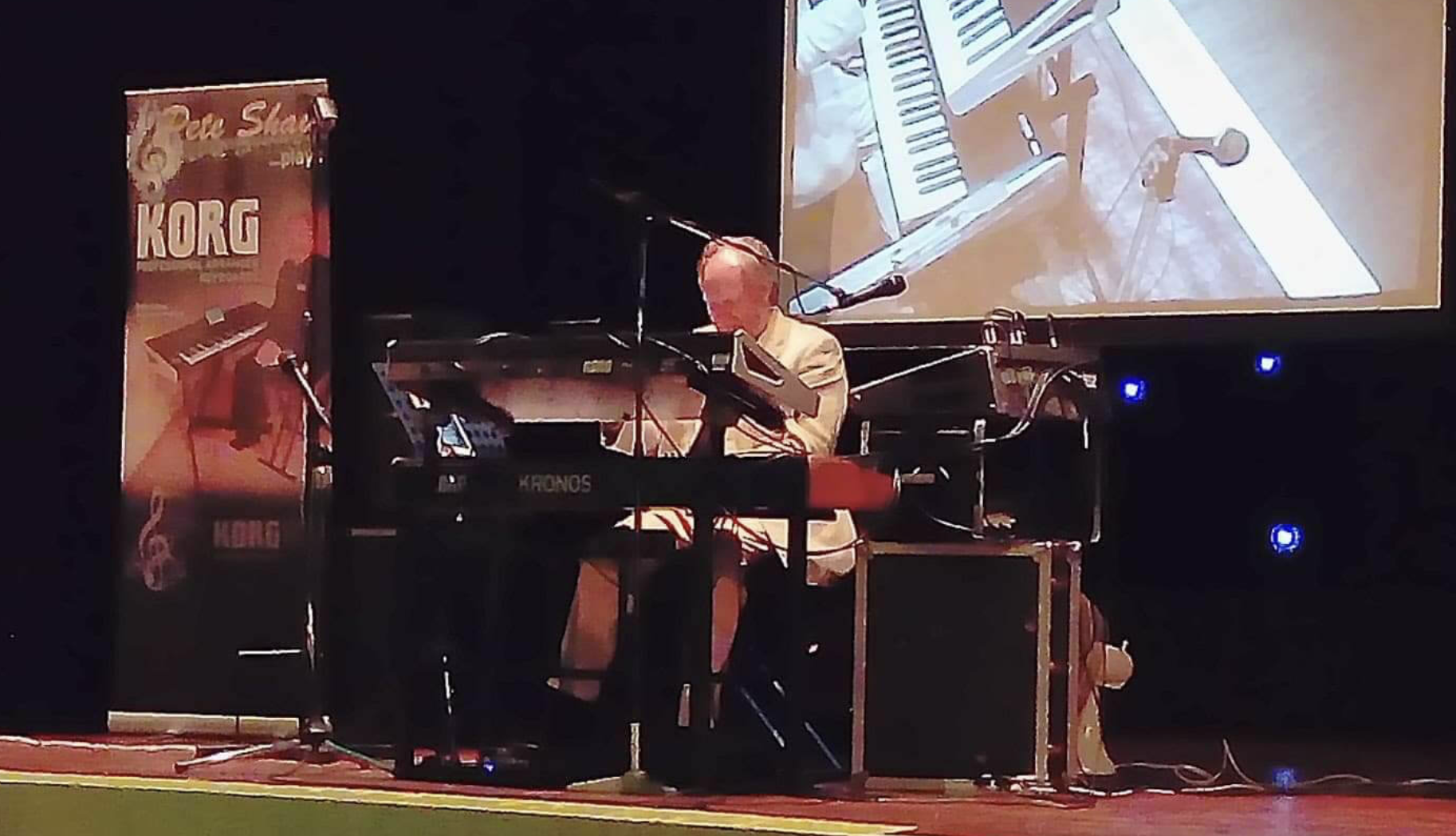 Live performance setup with musician at keyboard in The Addison Centre, showcasing audio-visual quality.