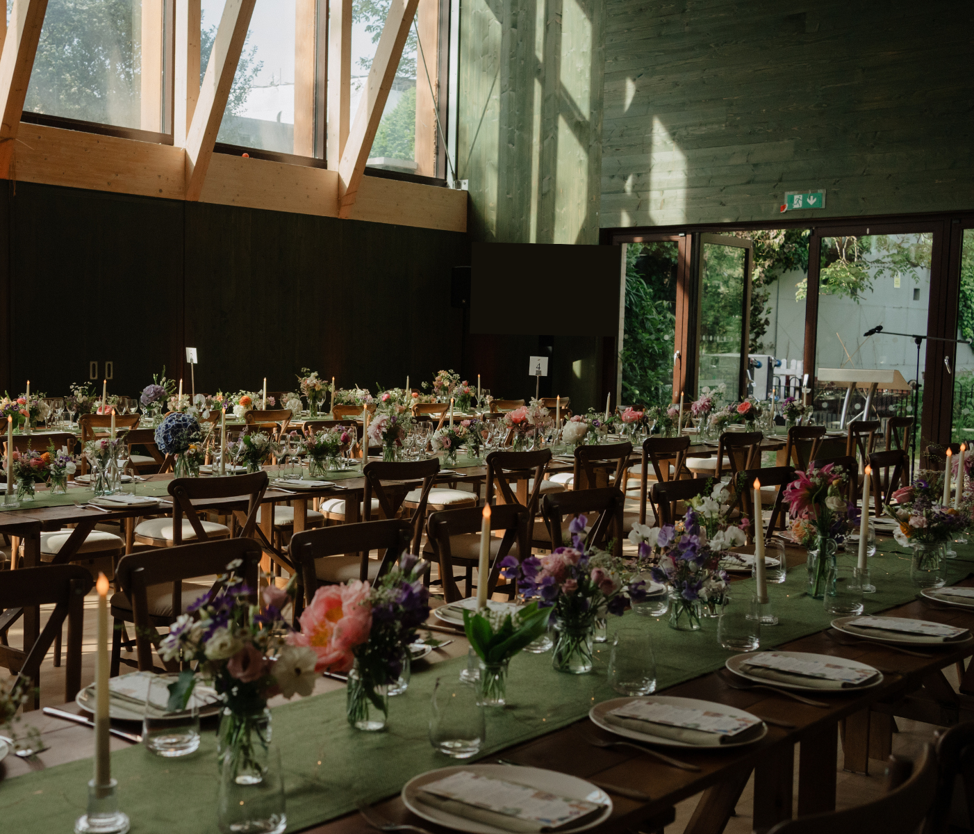 Elegant event space with floral centerpieces, perfect for weddings and receptions.