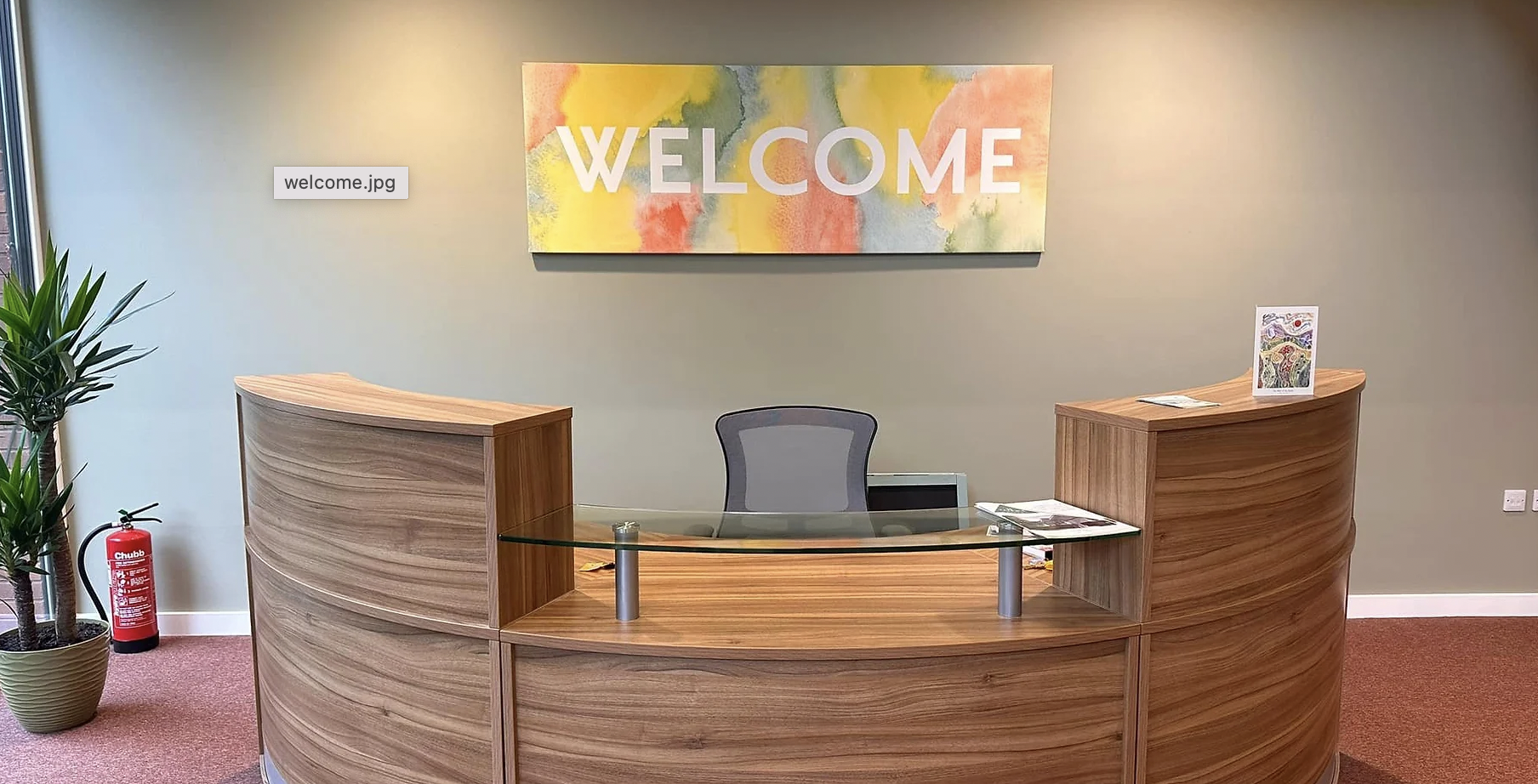 Modern reception area at St Faith’s Centre with welcoming sign for events and meetings.