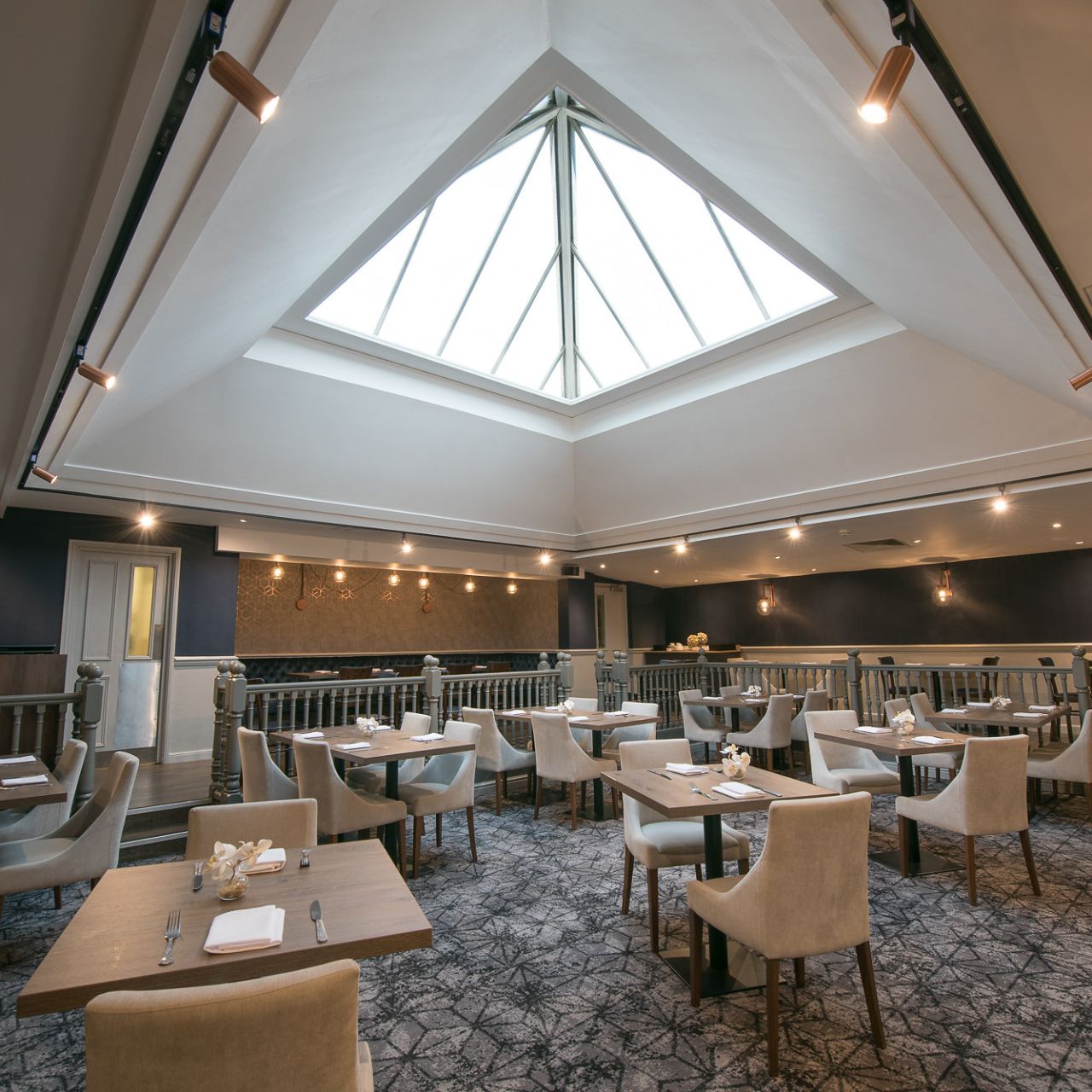 Stylish Westmead Hotel restaurant with elegant tables, ideal for corporate meetings and receptions.