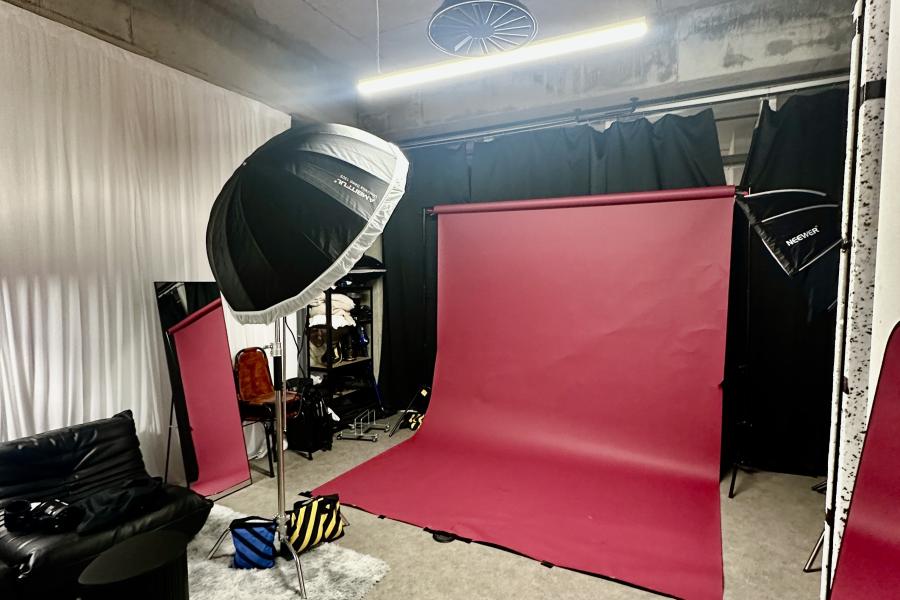 Luna in iD Studios with maroon backdrop, ideal for event branding photography.