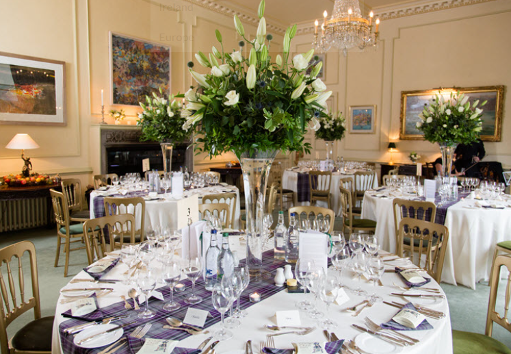 Elegant dining table with floral centerpieces in Dundas Castle marquee for weddings.
