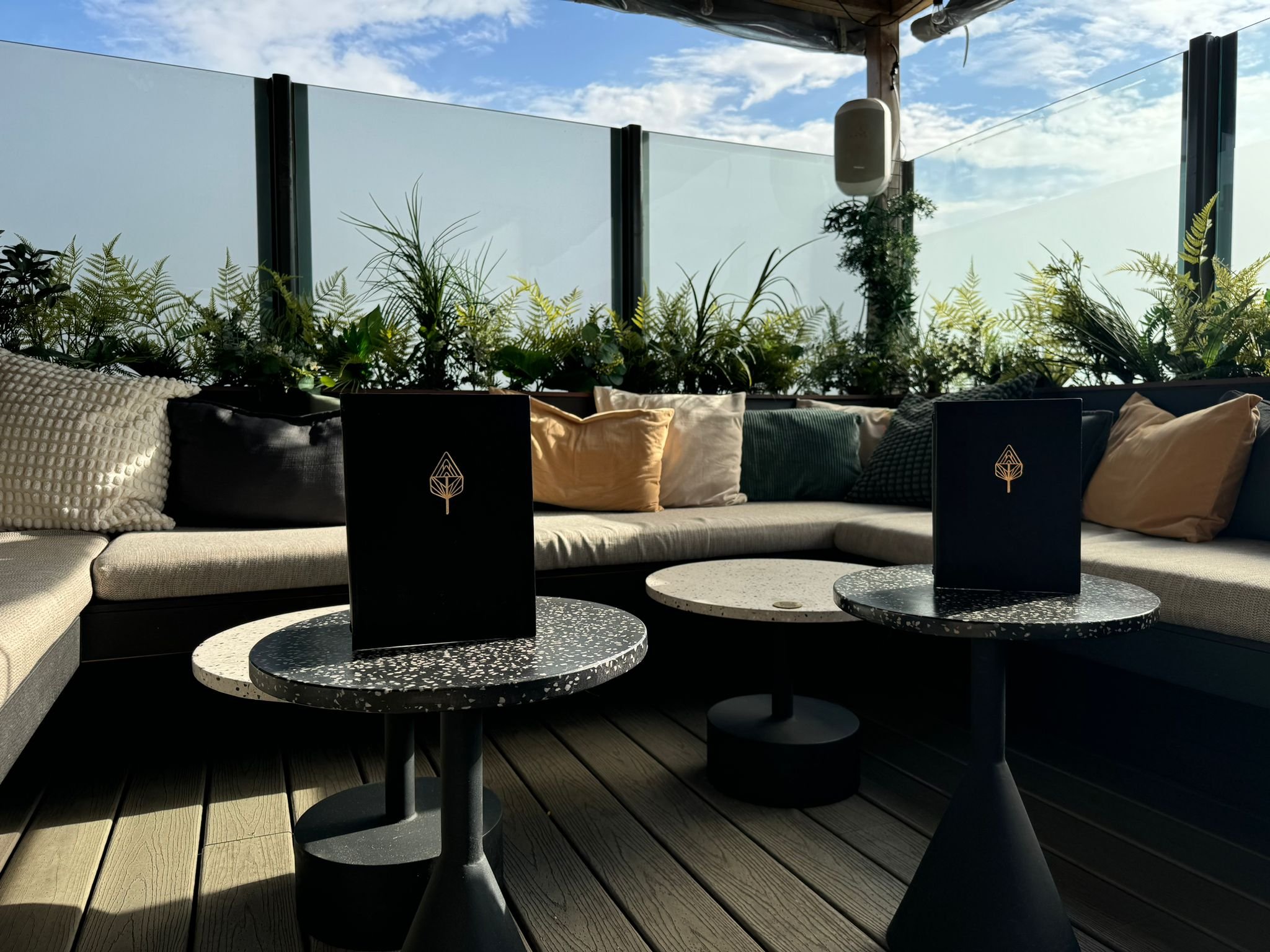 Stylish outdoor lounge at The Corin, perfect for networking events and meetings.