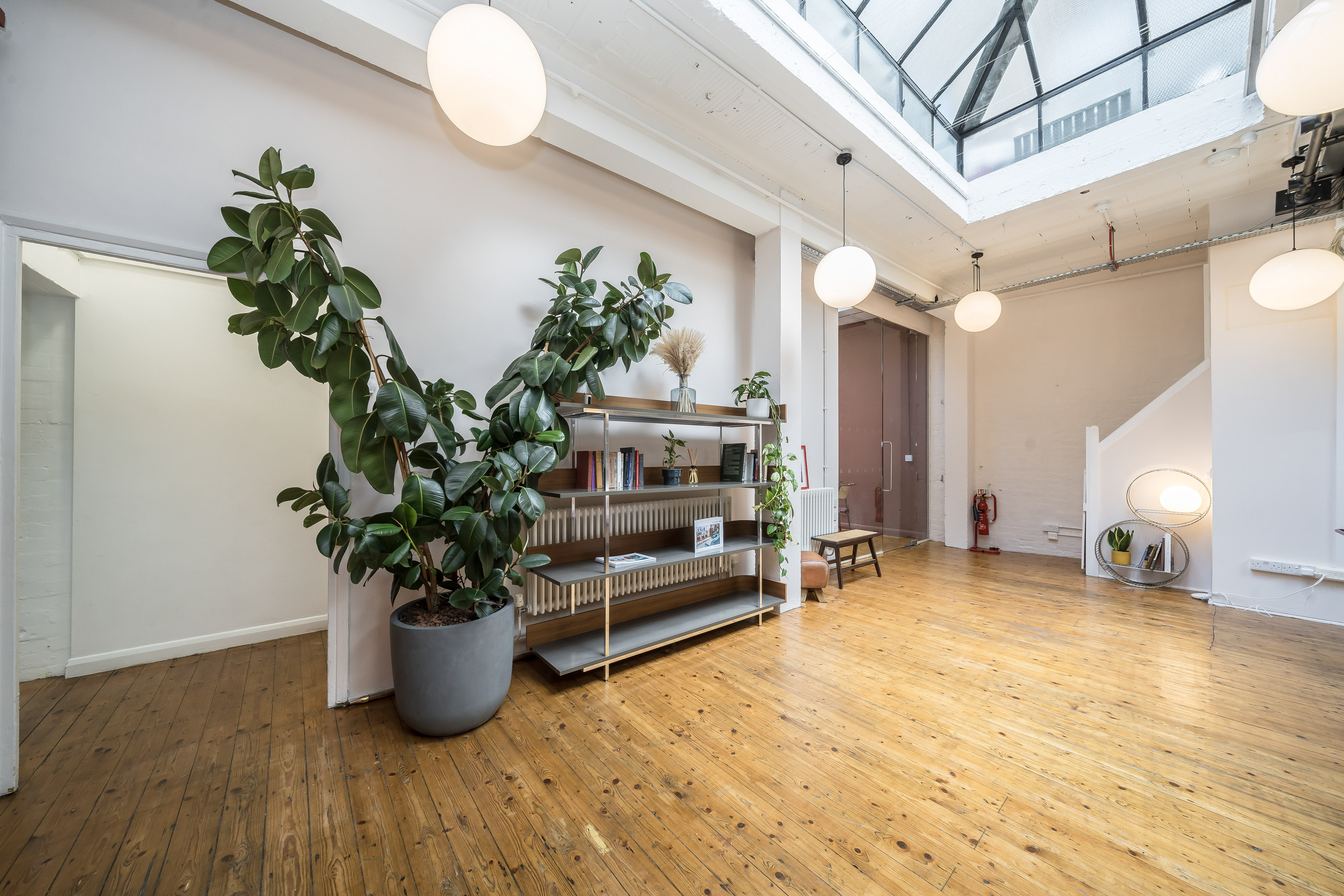 Spacious Menier Playhouse venue with skylight, ideal for workshops and events.