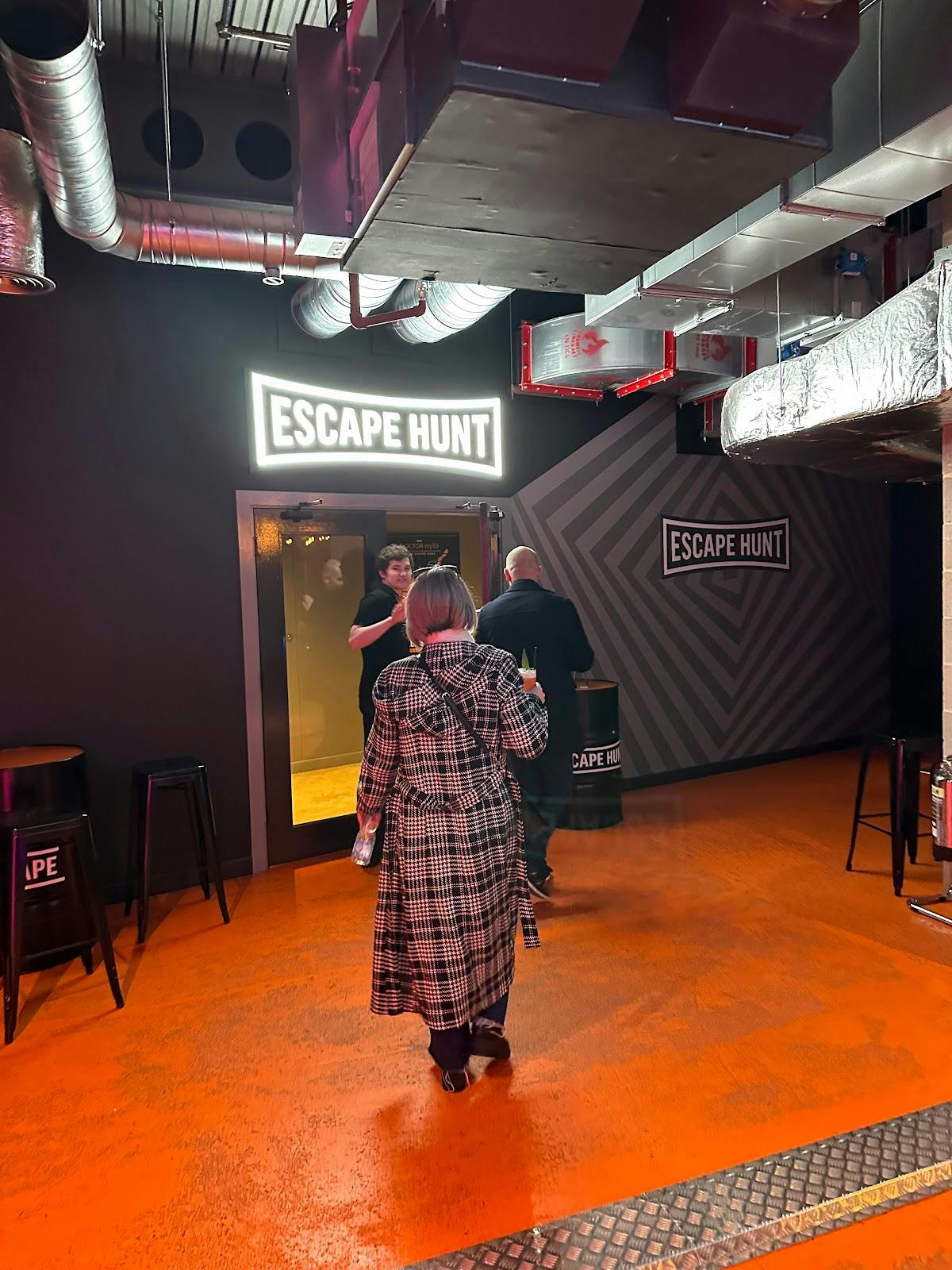 Vibrant entrance of Alice in Puzzleland escape room for team-building events.