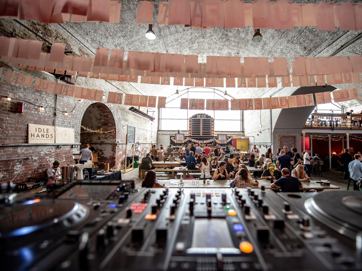 Vibrant Fairfield Social Club bar with rustic decor, ideal for social gatherings and networking.