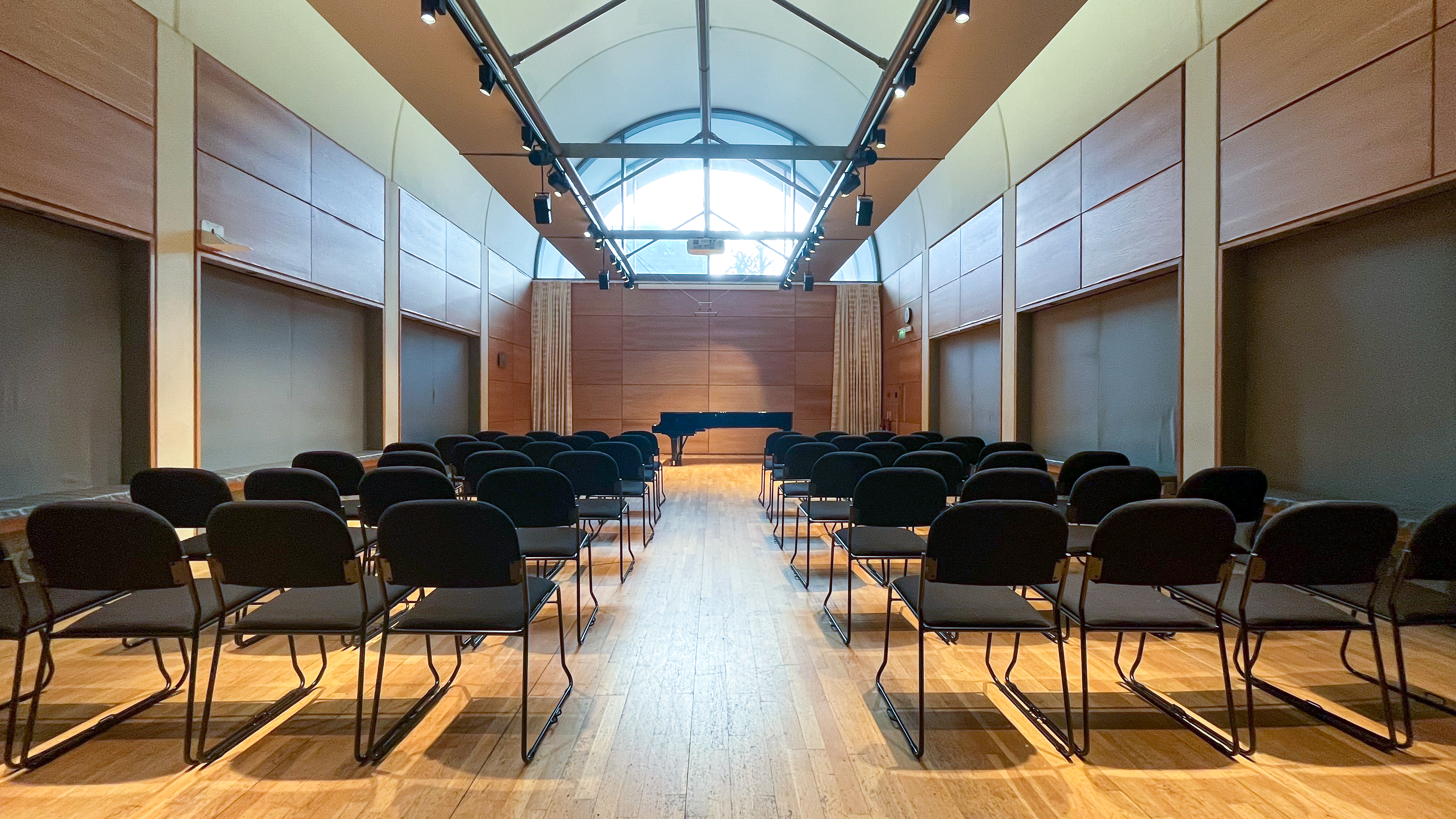 David Josefowitz Recital Hall with grand piano, ideal for performances and presentations.