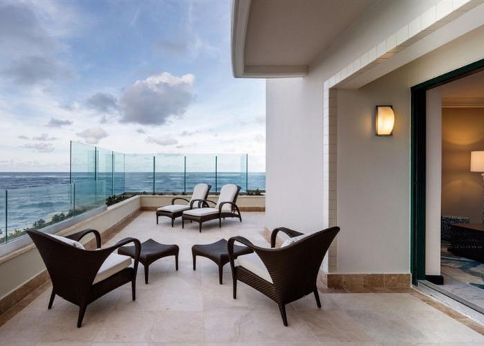 West Veranda at Condado Vanderbilt Hotel, ocean view seating for retreats and networking.