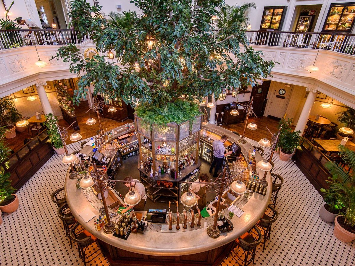 Private dining room at The Botanist Cardiff with lush greenery, perfect for events.