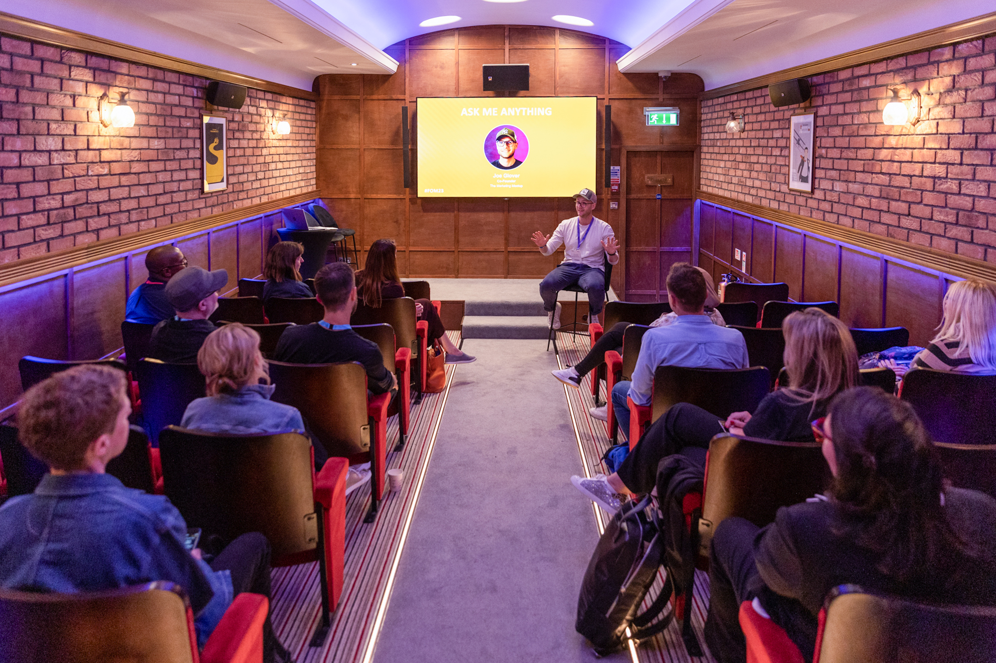 Grubstreet Cellars meeting space with screen, ideal for workshops and conferences.