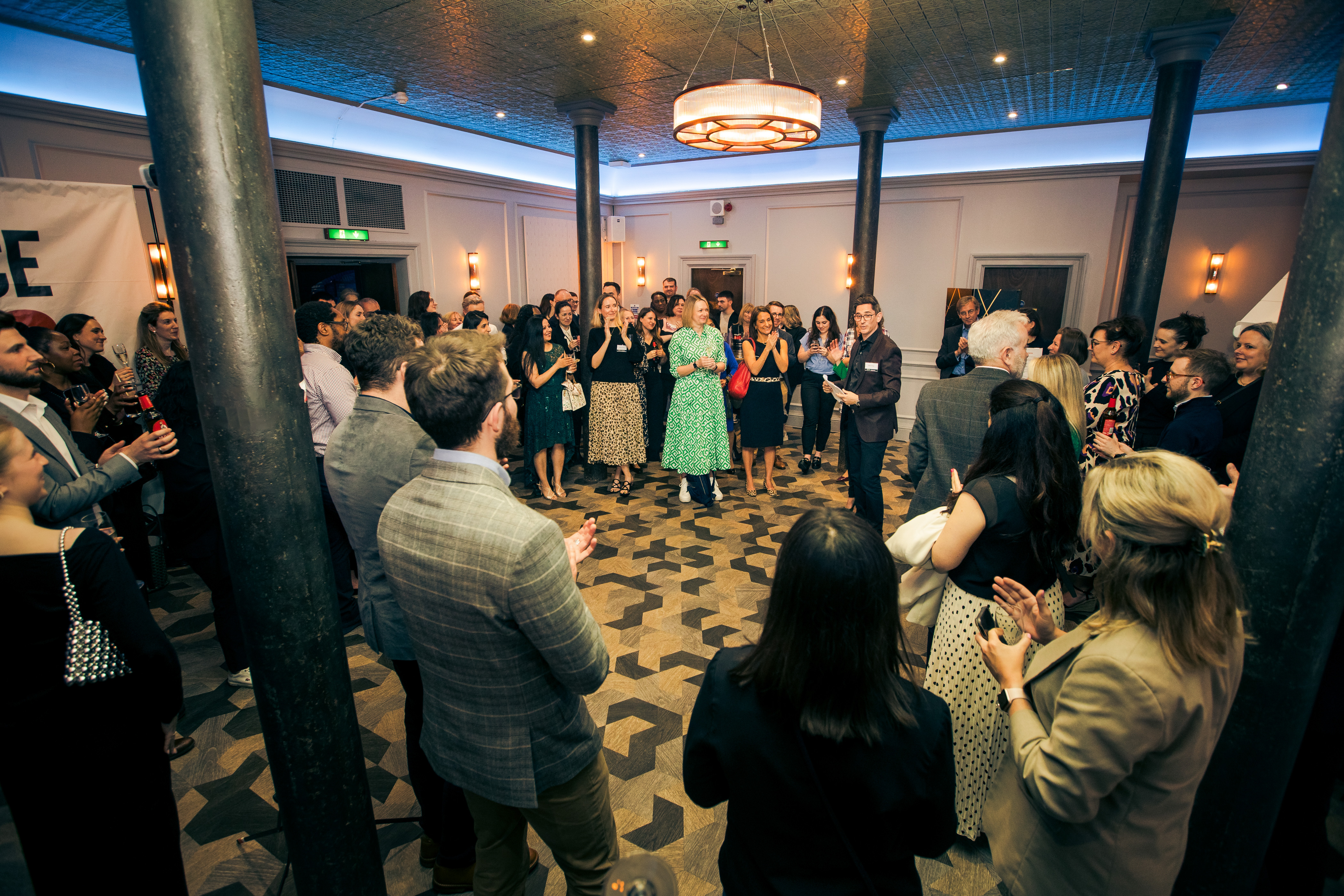 Vibrant networking event at Grubstreet Cellars, stylish venue with engaged attendees.