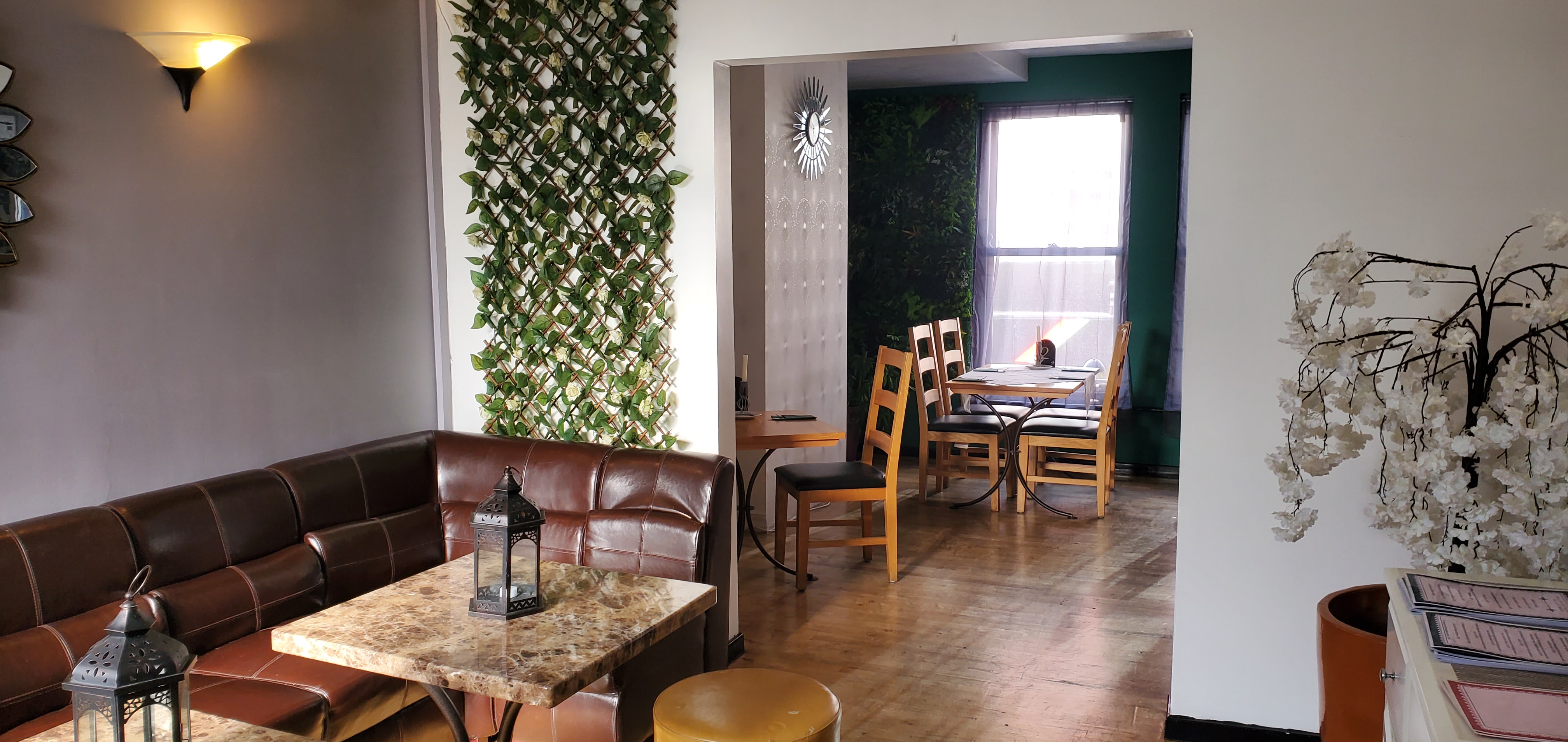 Versatile function room with greenery, ideal for networking events and workshops.