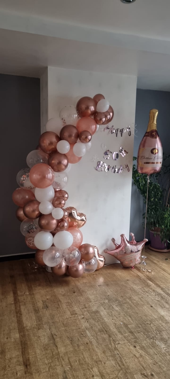 Festive rose gold balloon arch for a birthday celebration at Taste of Poland.