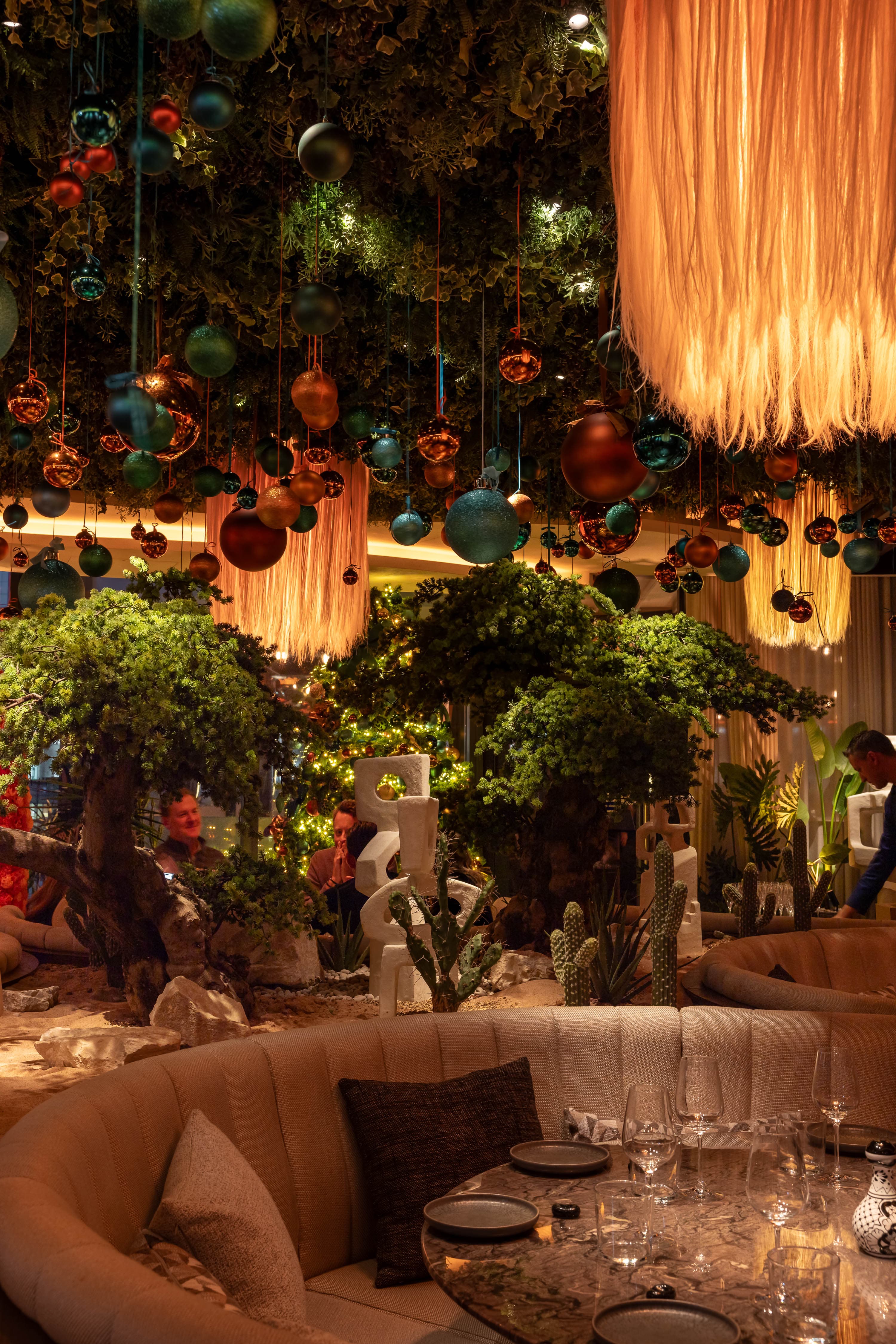 Mezzanine London experiential holiday event with layered ceiling decor for seasonal venue rental.