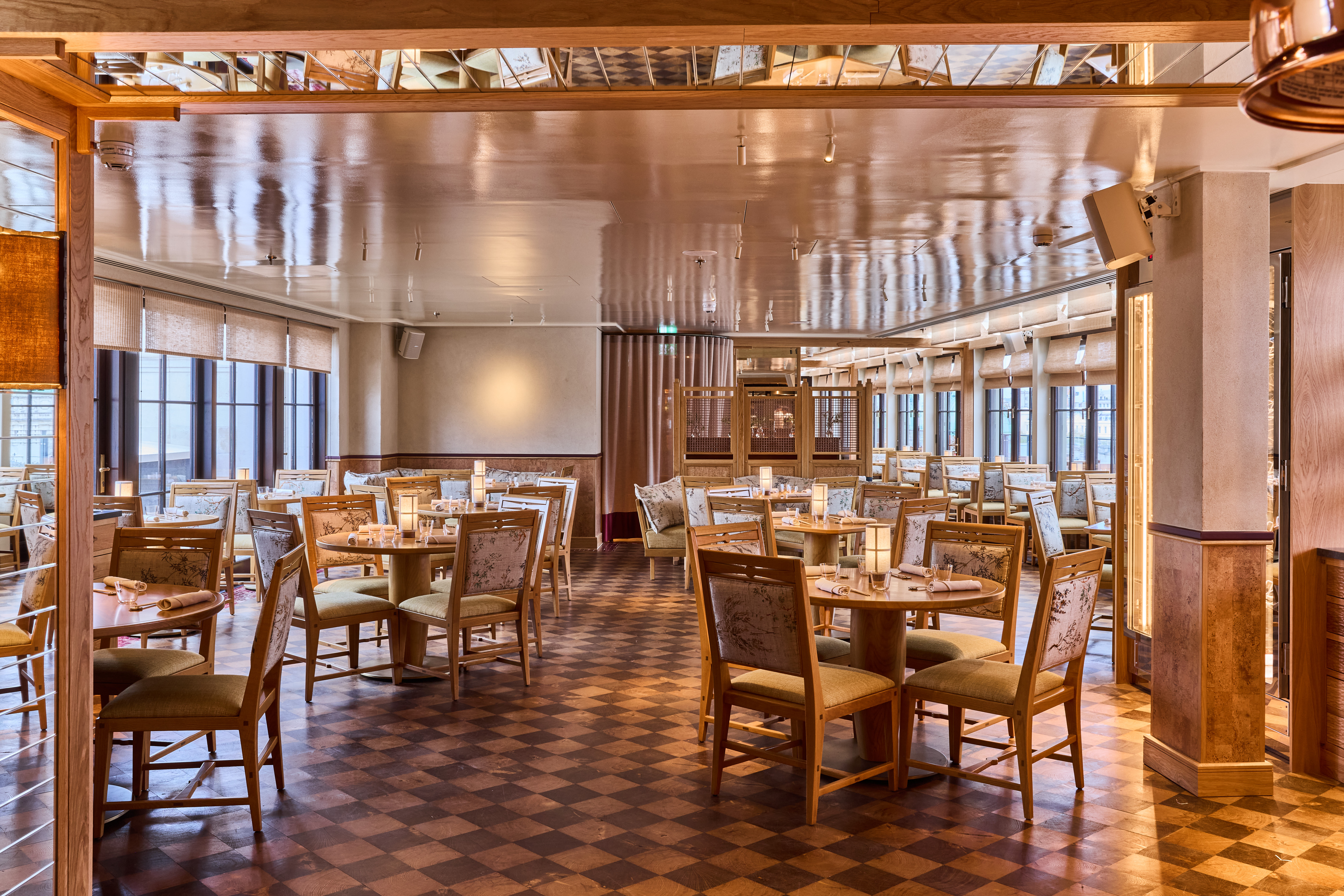 Elegant restaurant venue hire in Kioku, featuring warm wood tones and flexible seating.