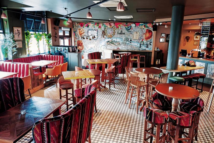 Malangatana venue with cozy booths, ideal for networking events and casual receptions.