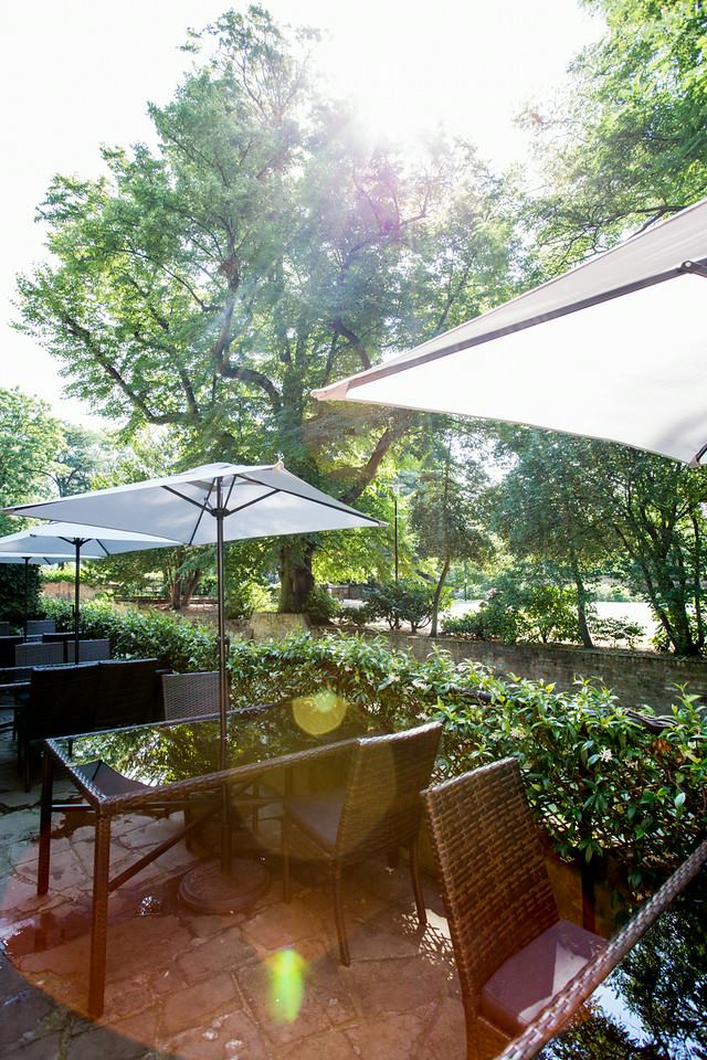 Moat Terrace at Tudor Barn Eltham: serene outdoor space for casual meetings and networking.