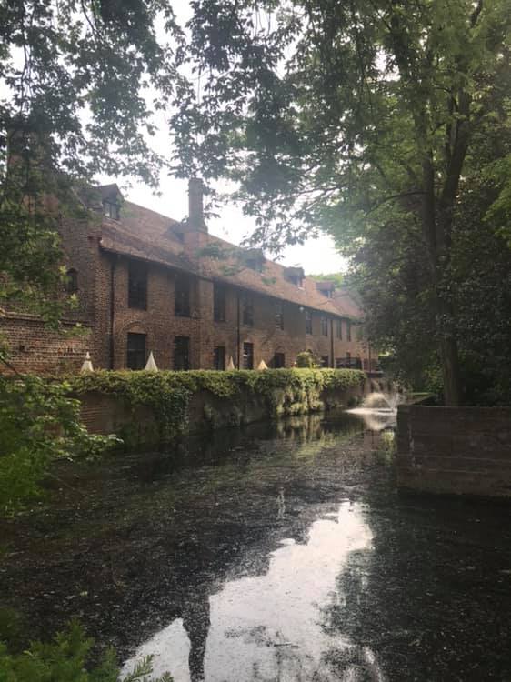 Moat Terrace at Tudor Barn Eltham, a charming venue for outdoor events by waterway.