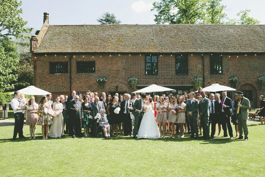 Outdoor wedding at Tudor Barn Eltham with lush green lawn and elegant decor.