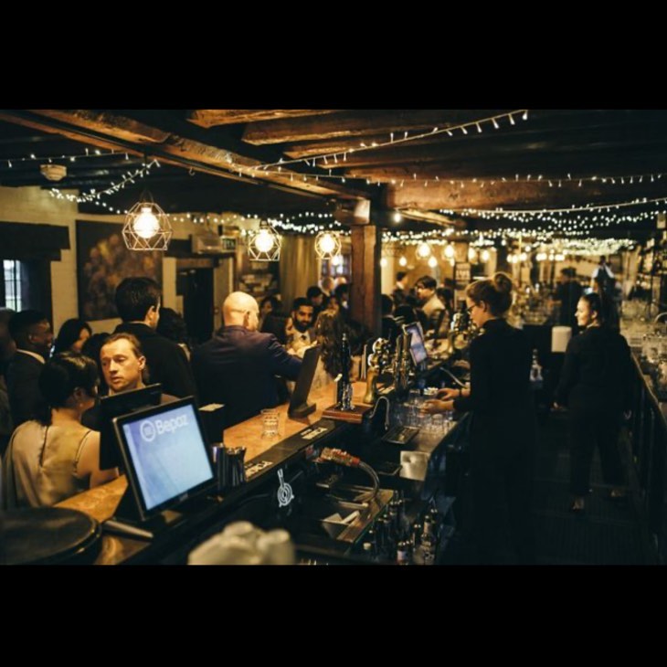 Vibrant networking event at Gastro Pub, Tudor Barn Eltham, with guests mingling.