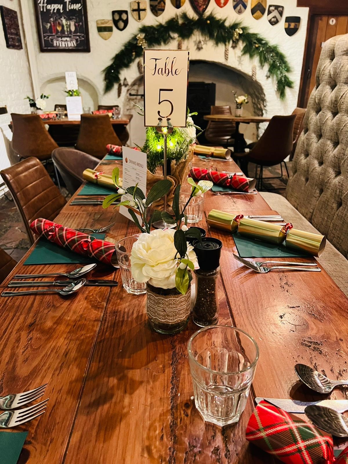 Gastro Pub dining table with floral centerpiece, perfect for holiday events and celebrations.