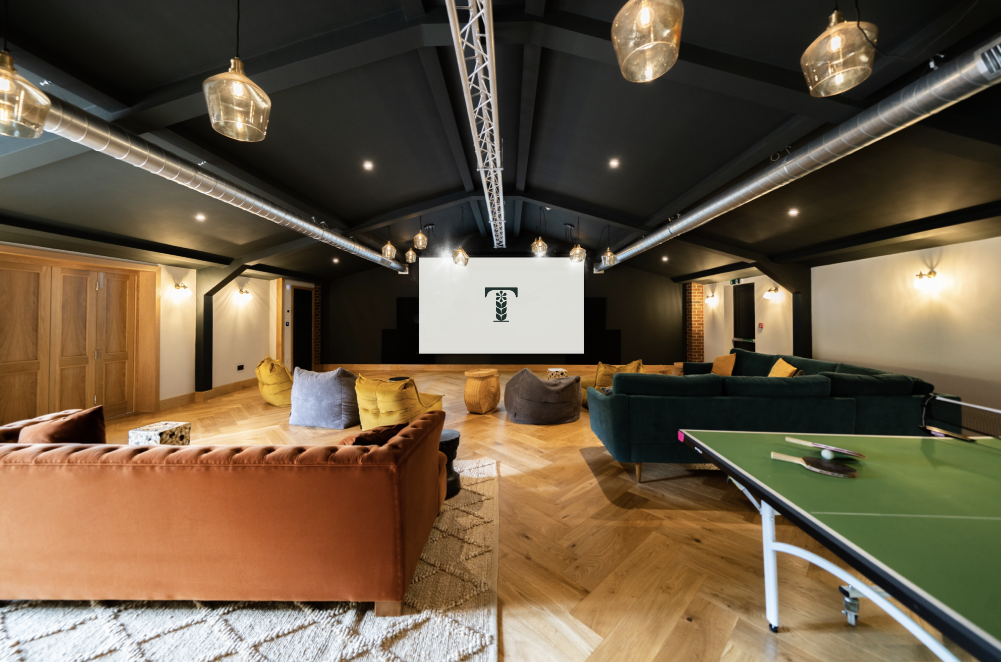 Versatile meeting space at Tewinbury Hotel with cozy seating for team-building events.