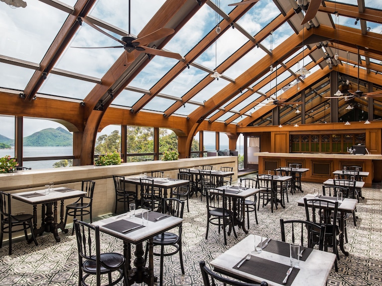 Wedding venue at Tai O Heritage Hotel with glass-roofed dining area, perfect for events.