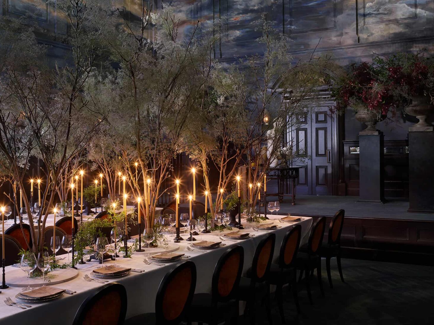 Elegant dining setup in Private Room, Cornus with greenery and candlesticks for upscale events.