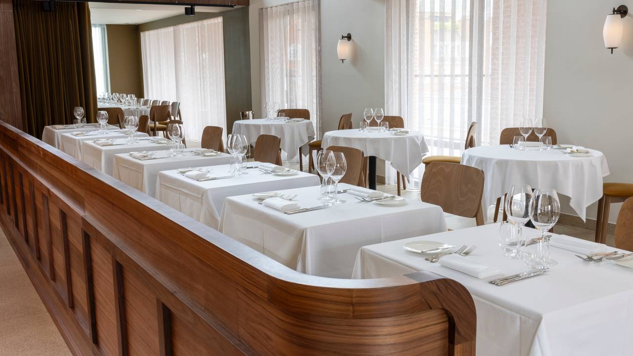 Sophisticated private dining room with elegant tables for intimate events and meetings.